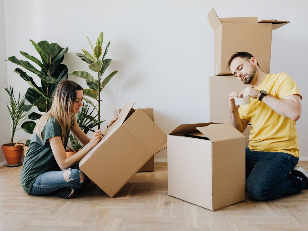 A couple unpacking boxes in a new apartment