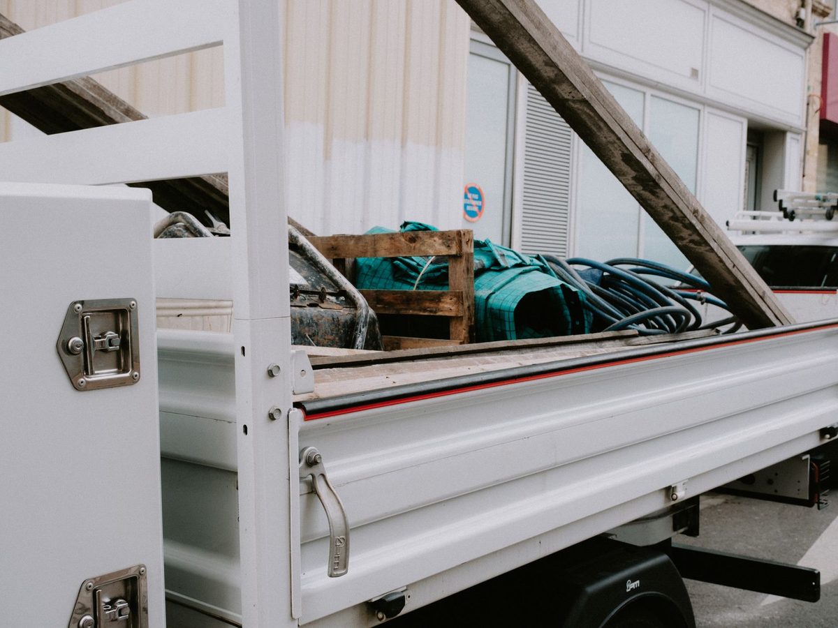 A work truck loaded with building materials on a job site