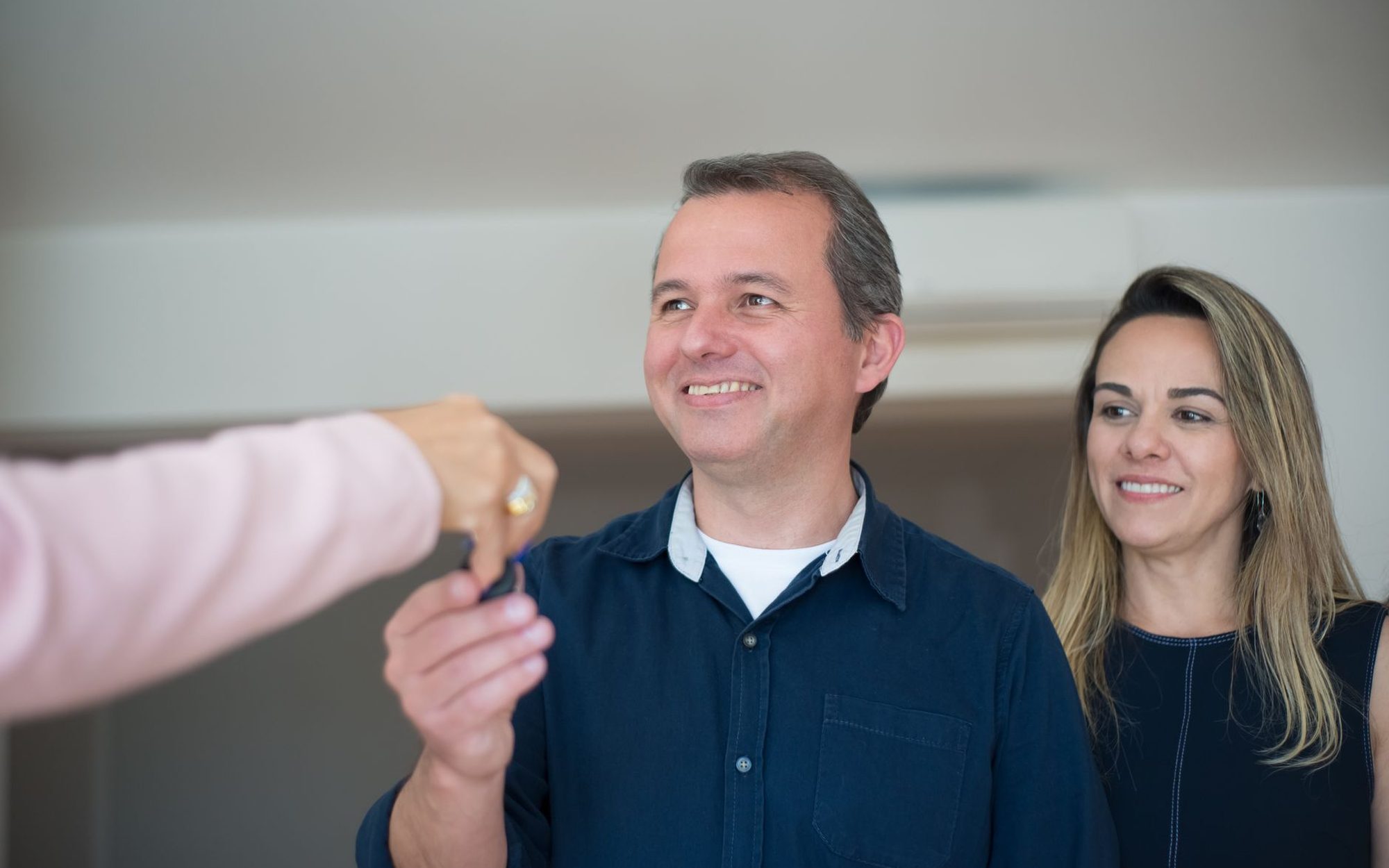 A couple receiving the keys to their new home